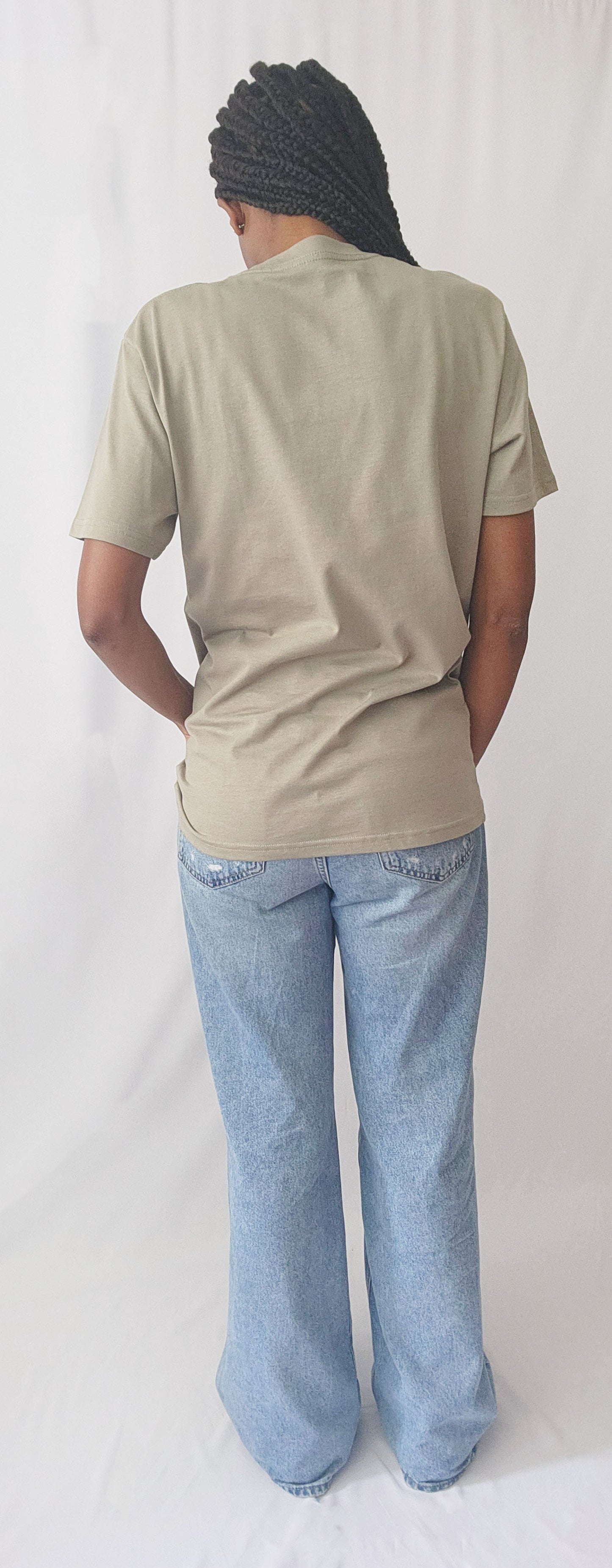 green tee on female model back