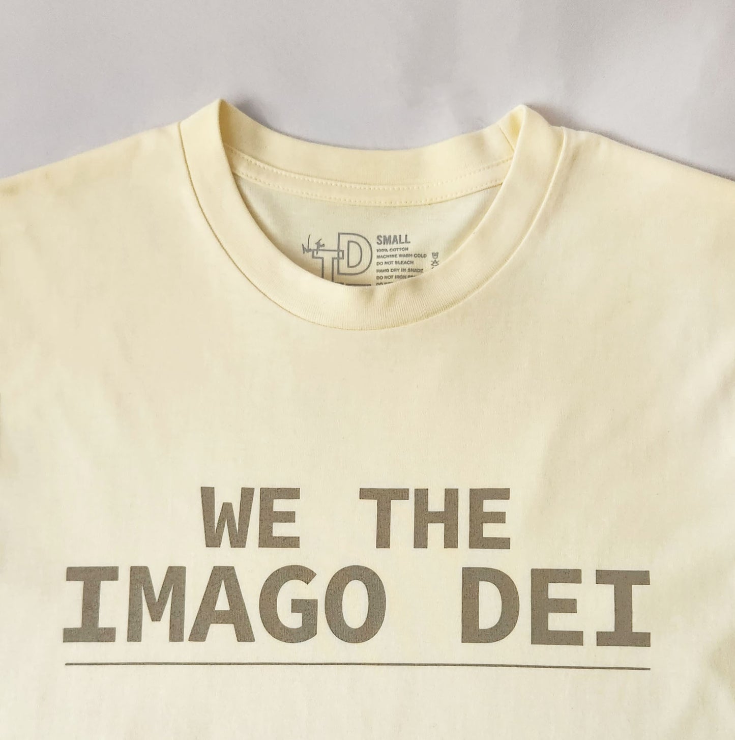 butter text front on tee